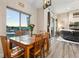 Inviting dining room featuring a wood table with seating for six and large windows offering natural light and landscape views at 20201 Royal Troon Dr, Monument, CO 80132