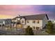 Rear exterior of home showing the walkout basement, large windows and spacious deck at 20201 Royal Troon Dr, Monument, CO 80132