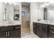 Luxurious main bathroom featuring dual vanities, modern tile floors, and a glass-enclosed walk-in shower at 20201 Royal Troon Dr, Monument, CO 80132