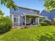 Large backyard with lush lawn, patio, and a two-story home at 9625 S Hackberry St, Highlands Ranch, CO 80129