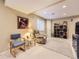 Finished basement space with comfortable seating and built in shelving at 9625 S Hackberry St, Highlands Ranch, CO 80129