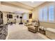 Finished basement area with gym, seating, and neutral carpet and walls at 9625 S Hackberry St, Highlands Ranch, CO 80129