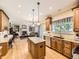 Gourmet kitchen with stainless steel appliances, granite countertops, and a center island at 9625 S Hackberry St, Highlands Ranch, CO 80129