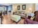 Inviting living room features hardwood floors and an open floor plan leading to dining area at 9625 S Hackberry St, Highlands Ranch, CO 80129