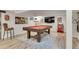 Finished basement features a beautiful pool table with custom accessories at 2496 S Leyden St, Denver, CO 80222