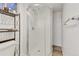 Modern bathroom shower with white subway tile, corner shower and fixtures at 2496 S Leyden St, Denver, CO 80222