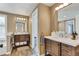 Bathroom featuring wood-look tile floor, double vanity and tile backsplash at 2496 S Leyden St, Denver, CO 80222