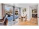 Bright dining area features a table for four and sliding glass doors leading to the backyard at 2496 S Leyden St, Denver, CO 80222