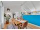 Bright dining room featuring wood floors, white ceilings, and stylish decor at 2496 S Leyden St, Denver, CO 80222