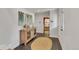 Inviting entryway featuring a decorative sideboard, a rug, and tile flooring at 2496 S Leyden St, Denver, CO 80222