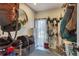 Mud room featuring ski storage, shelving, and a round mirror at 2496 S Leyden St, Denver, CO 80222