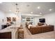 Spacious finished basement with a wet bar, media area, and comfortable seating, perfect for entertaining at 455 Forest St, Denver, CO 80220