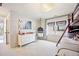Cozy bedroom featuring unique hanging chair, neutral decor, and a bunk bed at 455 Forest St, Denver, CO 80220