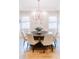 Bright dining room features a large chandelier and a round dining table at 455 Forest St, Denver, CO 80220
