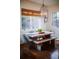 Dining room features a modern table with bench seating, chairs, and a decorative chandelier at 455 Forest St, Denver, CO 80220