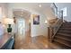 Hardwood floors flow through the foyer with a staircase and views of the entry at 455 Forest St, Denver, CO 80220