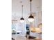 Kitchen with marble countertops, stainless steel appliances, and stylish pendant lighting at 455 Forest St, Denver, CO 80220