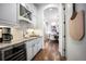 Modern kitchen features custom cabinetry, stainless steel appliances, and a wine fridge at 455 Forest St, Denver, CO 80220