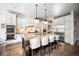 Spacious kitchen with white cabinets, stainless steel appliances, and a large island at 455 Forest St, Denver, CO 80220