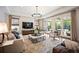 Bright living room features hardwood floors, a decorative rug, and patio doors at 455 Forest St, Denver, CO 80220
