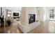 Bright living room featuring a fireplace, hardwood floors, and neutral décor at 455 Forest St, Denver, CO 80220