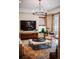 Living room with hardwood floors, modern lighting, and a stylish entertainment center at 455 Forest St, Denver, CO 80220