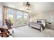 Spacious main bedroom with a metal bed frame, large windows, and balcony access at 455 Forest St, Denver, CO 80220