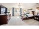 Serene main bedroom featuring a large window, elegant decor, and comfortable furnishings at 455 Forest St, Denver, CO 80220