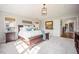 Bright bedroom featuring a large window, a bed with stylish pillows, and lots of natural light at 455 Forest St, Denver, CO 80220