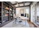 Bright office with built-in bookshelves, coffered ceiling, and a modern adjustable-height desk at 455 Forest St, Denver, CO 80220