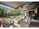 Outdoor seating area complete with fire pit, television, and plush seating at 455 Forest St, Denver, CO 80220