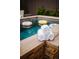 Close up view of the pool featuring rolled white towels along the ledge at 455 Forest St, Denver, CO 80220