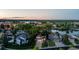 Beautiful neighborhood with lush trees and a pond. The house has solar panels for energy efficiency at 6266 Holman St, Arvada, CO 80004