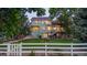 The rear exterior reveals a spacious, fenced yard and deck, ideal for outdoor enjoyment and privacy at 6266 Holman St, Arvada, CO 80004