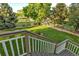Beautifully landscaped backyard with pond views and white fence at 6266 Holman St, Arvada, CO 80004