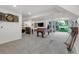 Spacious basement with a pool table, lounge area, and walkout access to the backyard at 6266 Holman St, Arvada, CO 80004