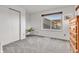 Bedroom featuring closet, window with neighborhood view, desk, and dresser at 6266 Holman St, Arvada, CO 80004