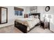 Bedroom with a large bed with pillows, and a window to let in plenty of natural light at 6266 Holman St, Arvada, CO 80004