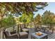 Sprawling deck has outdoor seating, dining area, and cozy fire pit at 6266 Holman St, Arvada, CO 80004