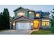 Charming two-story home with stone accents, updated garage doors, and solar panels at 6266 Holman St, Arvada, CO 80004
