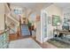 Welcoming foyer featuring a staircase, hardwood floors, neutral walls, and office space at 6266 Holman St, Arvada, CO 80004