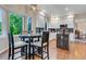 Eat-in kitchen features white cabinets, granite countertops, and stainless appliances at 6266 Holman St, Arvada, CO 80004