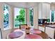 Kitchen nook table is set and overlooks beautiful mature trees at 6266 Holman St, Arvada, CO 80004