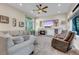 Spacious living room boasts a cozy fireplace and recessed lighting at 6266 Holman St, Arvada, CO 80004