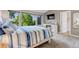 Main bedroom features a fireplace, large windows, and en-suite bath at 6266 Holman St, Arvada, CO 80004