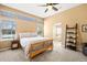 Bright bedroom with large windows, neutral color palette, and access to the bathroom, creating a serene and inviting space at 8403 S Miller Ct, Littleton, CO 80127