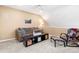 Cozy bonus room featuring a comfortable sofa and ample space for recreation at 8403 S Miller Ct, Littleton, CO 80127