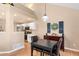 Dining area with modern table and chairs seamlessly connected to the kitchen, perfect for casual dining and entertaining at 8403 S Miller Ct, Littleton, CO 80127