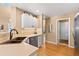 Modern kitchen featuring stainless steel appliances, white cabinets, and plenty of counter space, perfect for cooking and entertaining at 8403 S Miller Ct, Littleton, CO 80127