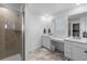 Bathroom featuring double sinks, shower, and a spacious vanity area at 14800 Hudson St, Thornton, CO 80602